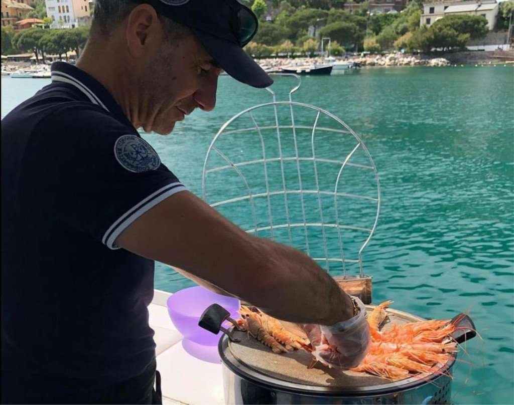 Cinque Terre only for you by a fishing boat with grilled seafood on board